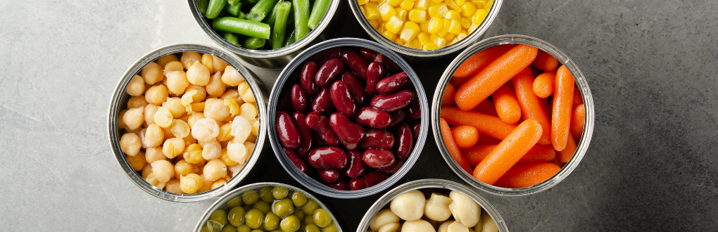 Aerial photo of opened cans of various non-perishable foods