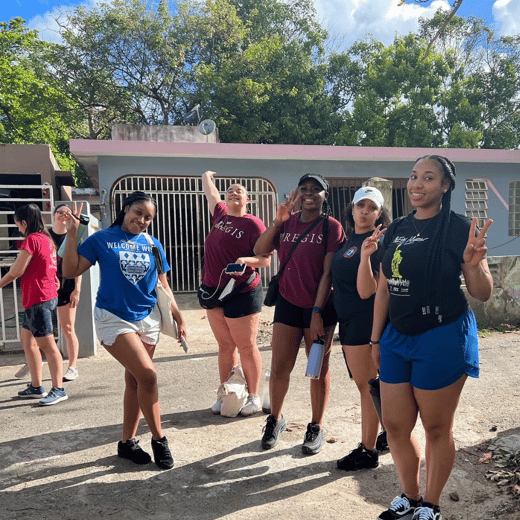Students in Regis gear at a service site in Puerto Rico