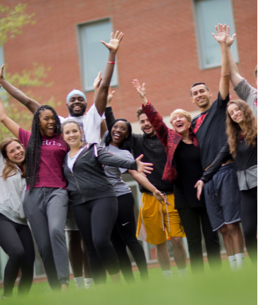 Regis students posing on the Quad with President Hays