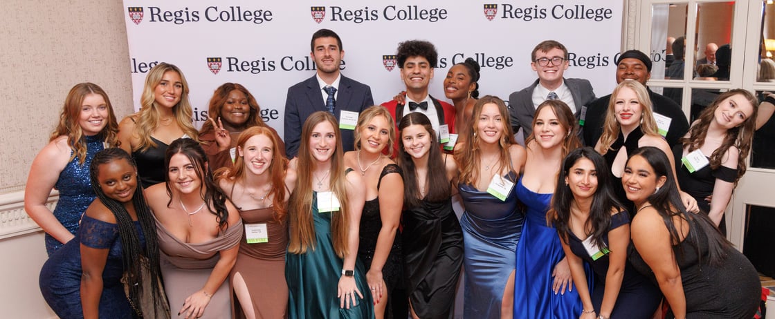 Regis students in formal attire at the Let It Shine Gala